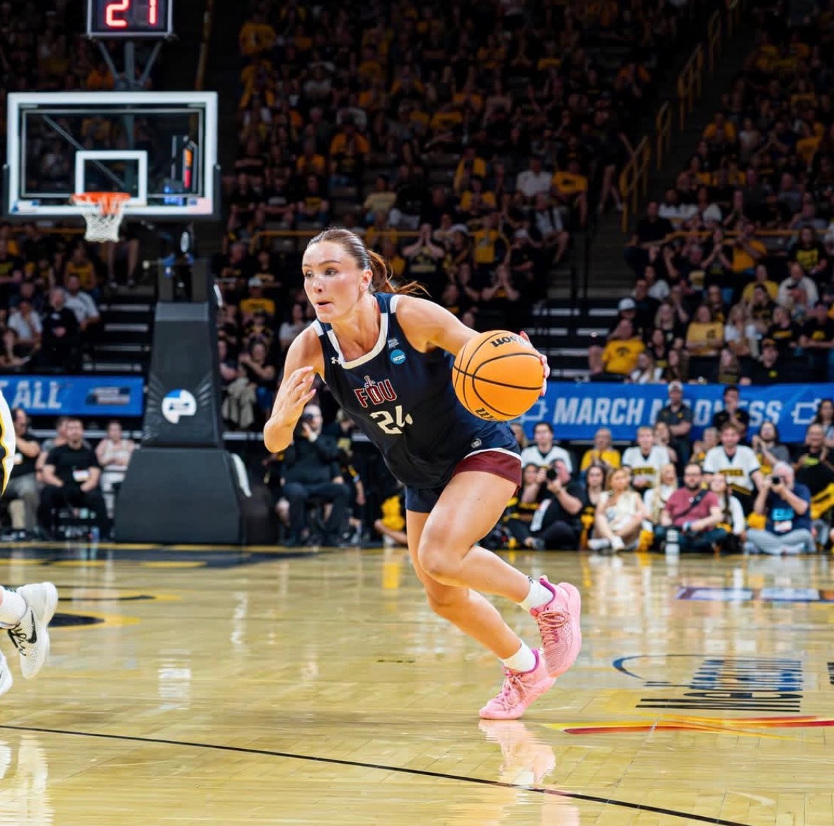 Kailee competing in a Division I basketball game